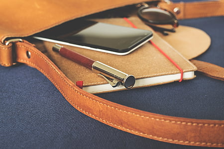 brown and gray case pen on brown notebook thumbnail