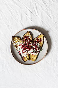 cherry with fried food on white and brown plate thumbnail