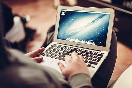 person using MacBook Air thumbnail