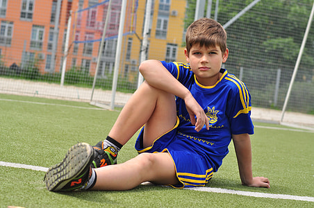 boy sitting on grass thumbnail