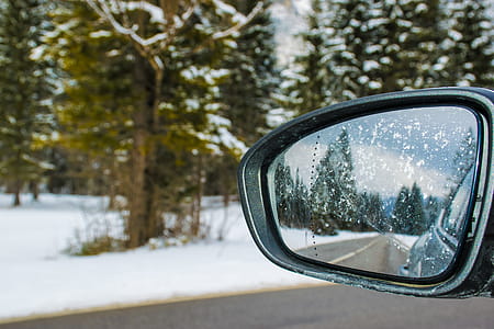 Framed Side Mirror Beside Snow Covered Field thumbnail