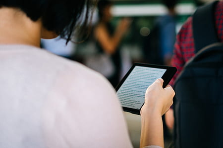 woman holding e-reader thumbnail