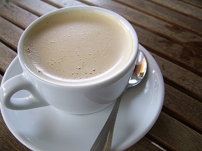 white ceramic cup on top of saucer thumbnail