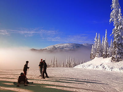 four person standing on snowfield thumbnail