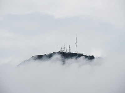 gray metal towers on top of mountain at daytime thumbnail