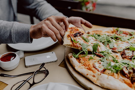Eating delicious pizza in a cozy restaurant thumbnail