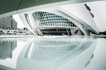 white building surrounded by water during daytime thumbnail