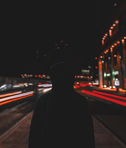 silhouette photograph of person wearing hoodie thumbnail