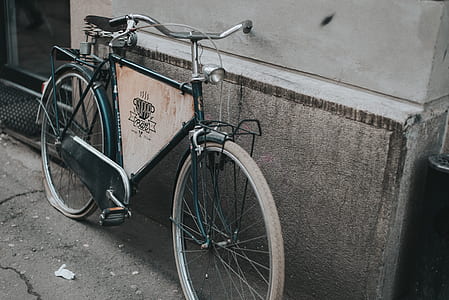 black dutch bike leaning on wall thumbnail