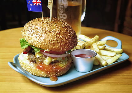 burger with fries and dipping sauce on tray thumbnail