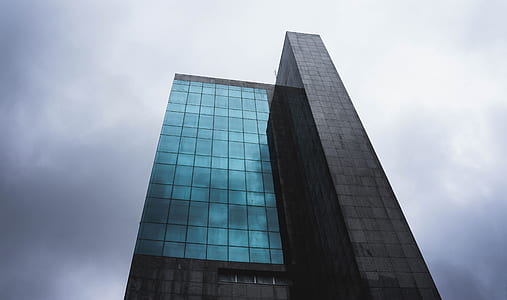 low angle photography of gray concrete building thumbnail