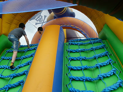 boy climbing on blue ladder thumbnail