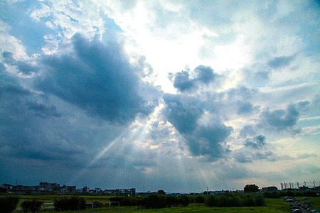 sunrays photo through black clouds thumbnail