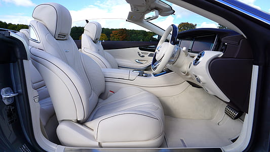 black convertible with grey car interior during daytime thumbnail