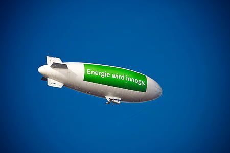 white and green Energie wird innogy-printed airship thumbnail