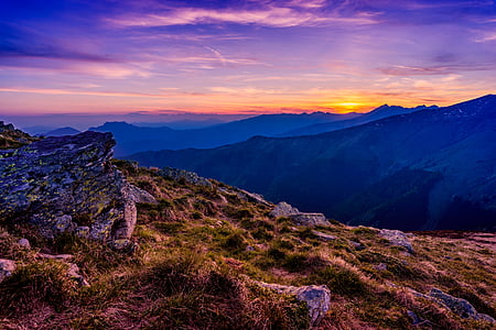 grass field on mountain under blue sky thumbnail