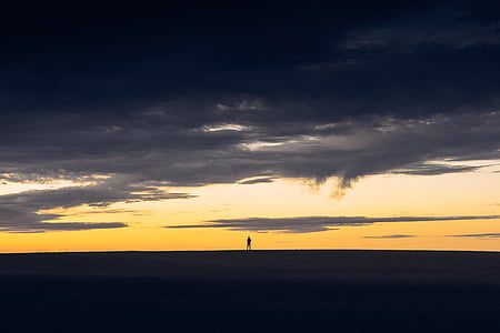 silhouette of man under cloudy sky during daytome thumbnail