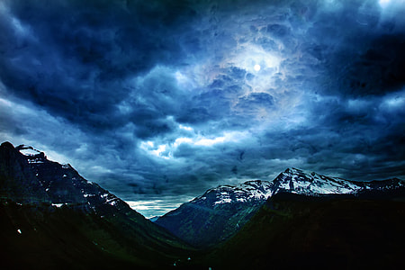 photo of mountain covered by snow during nighttime thumbnail