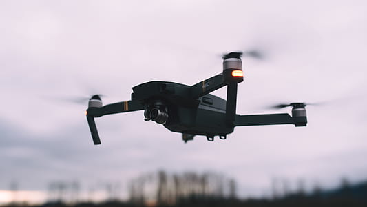black RC drone on mid air thumbnail