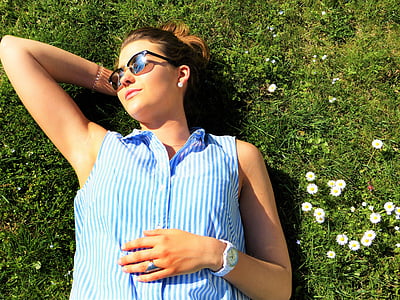 woman laying on grass with flowers thumbnail