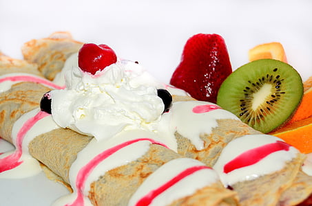 macro photography of ice cream, sliced fruits and spring rolls thumbnail