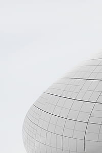 minimalist photography of oval checked structure thumbnail