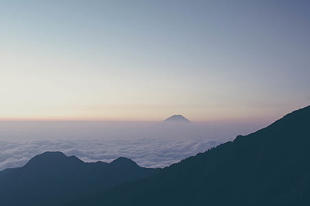 gray mountains and white clouds at daytime thumbnail