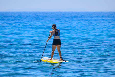 woman on skimboard during daytime thumbnail