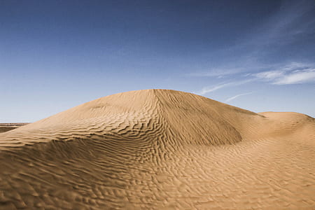 brown dessert under blue sky thumbnail