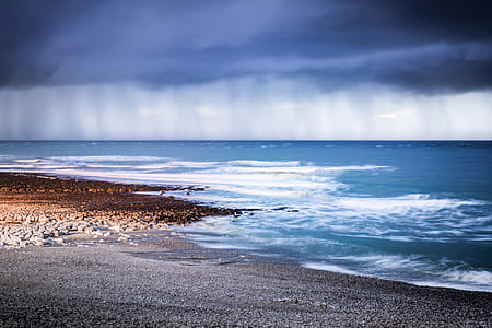 ocean waves under gray sky during daytime thumbnail