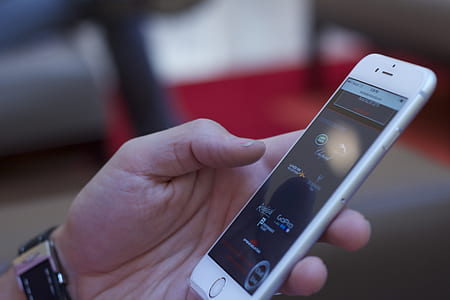 person holding silver iPhone 6 thumbnail