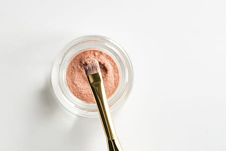 makeup brush with pink powder thumbnail