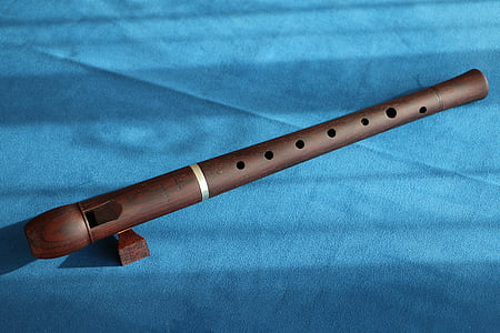 brown flute on blue textile thumbnail