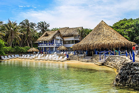 white concrete house near body of water thumbnail