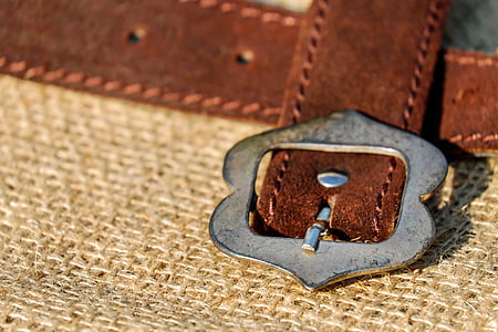 brown leather belt with silver-colored buckle thumbnail