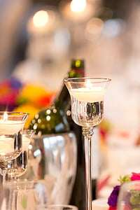 lit tealight candles on candle holders thumbnail