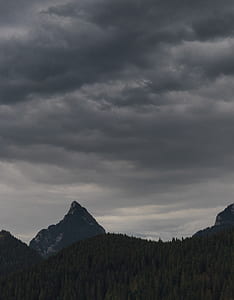 green mountain under cloudy sky thumbnail