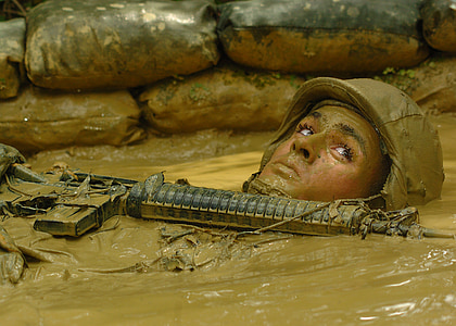 man holding rifled soak on mud thumbnail