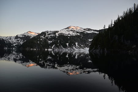 bodies of water near mountain coated with snow thumbnail