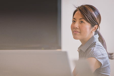 woman in gray top sitting thumbnail