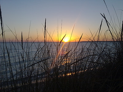 photo of sunrise near seashore thumbnail
