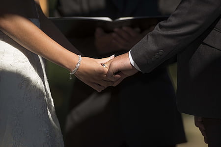 man and woman holding hands together thumbnail