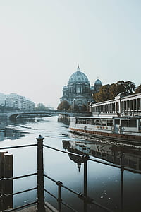 white concrete dome beside body of water thumbnail