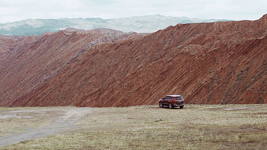 red SUV on field thumbnail