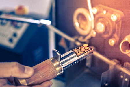 person holding brown and gray steel tool thumbnail