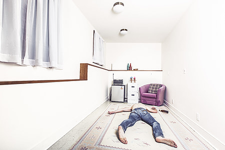 man sleeping on white carpet thumbnail