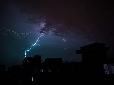 silhouette photo of house with lightning strike thumbnail
