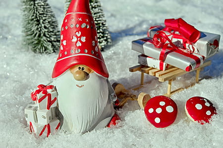 closeup photo of gnome with presents and pine tree thumbnail