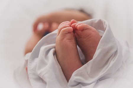 selective focus photography of baby's feet thumbnail