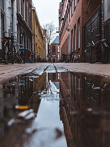 photo of bikes park beside building thumbnail